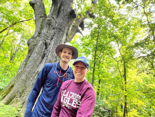 A selfie of me and Emily in front of the largest tree in Illinois.