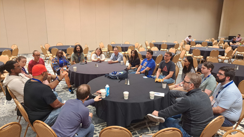 Several Django community members participating in an open space around maintaining Python packages.