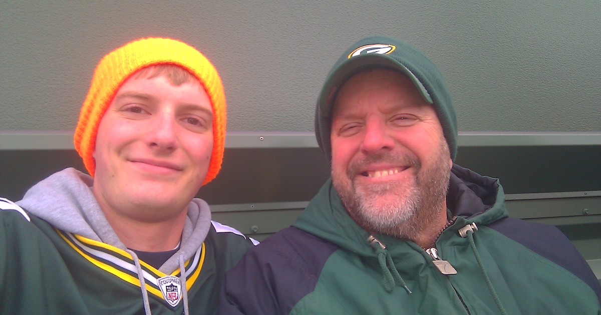A photo of me and my dad at a Packers game years ago.